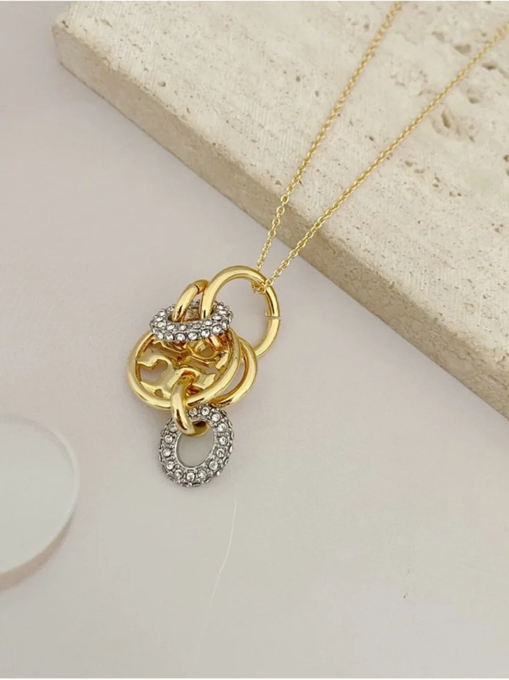 Tory Burch Gold-Tone Interlocking Circle Pendant with Crystal Accents